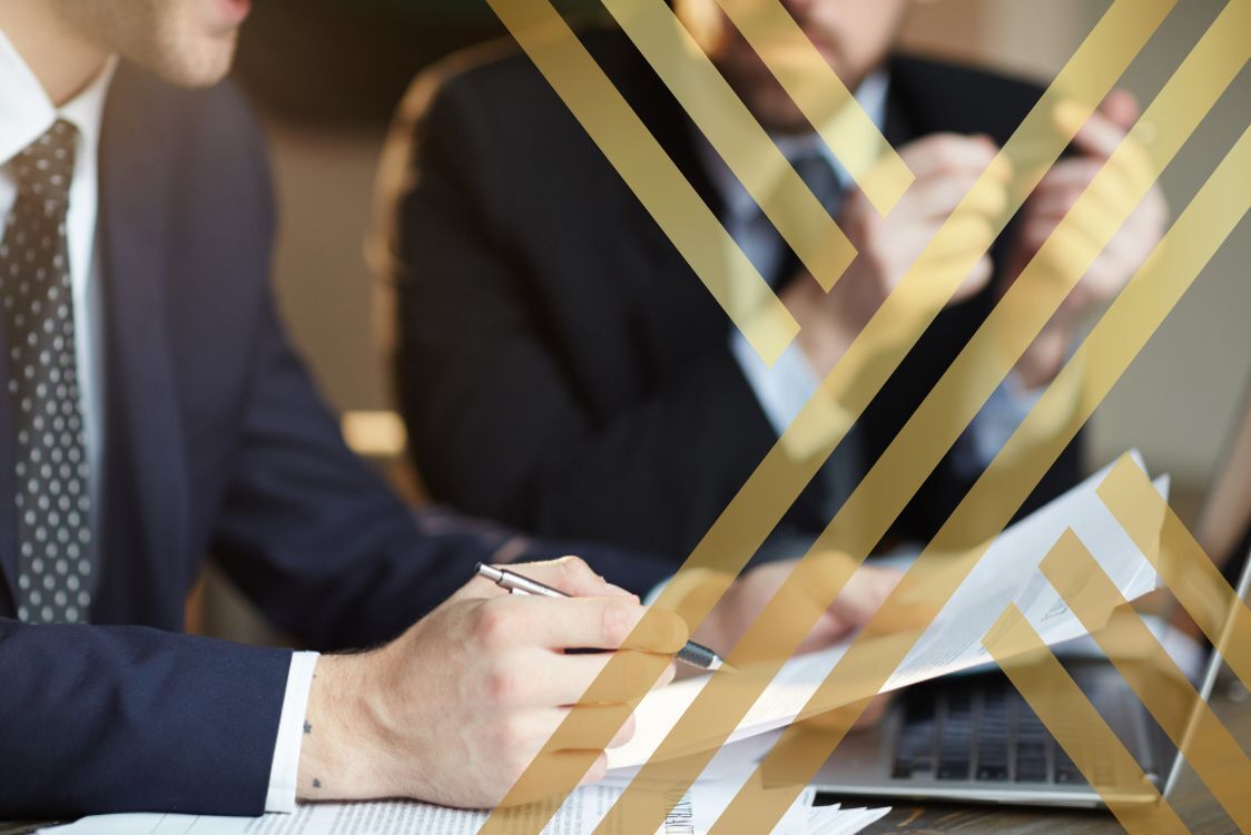 Commercial Litigation A Comprehensive Guide to Key Processes, Legal Implications, and Strategies (Business man sitting with his lawyer discussing the commercial disputes and litigation steps)