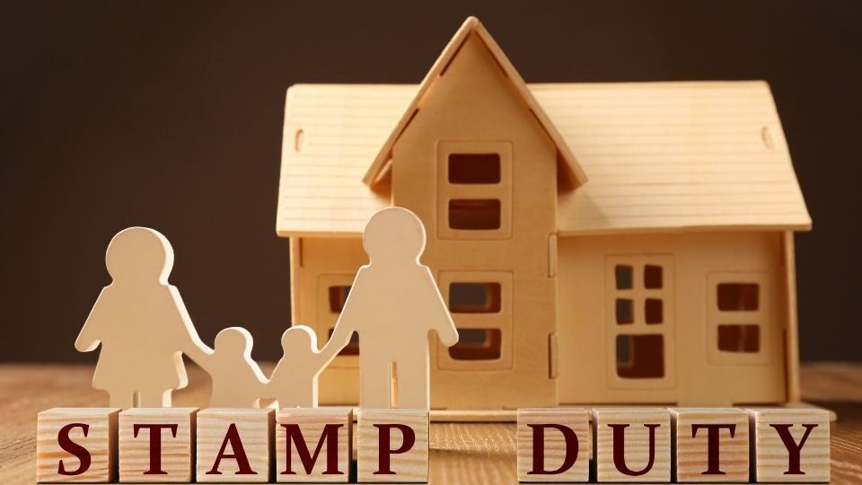 (In the image it can bee seen a house is displayed along with a family indicating how stamp duty will affect your move) Changes in Stamp Duty UK 2025 How Does This Impact Your Move