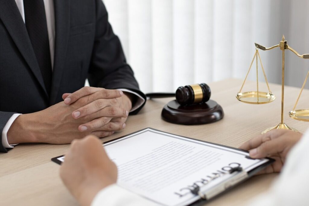 This image is showing a a civil litigator is advising a client before the court hearing