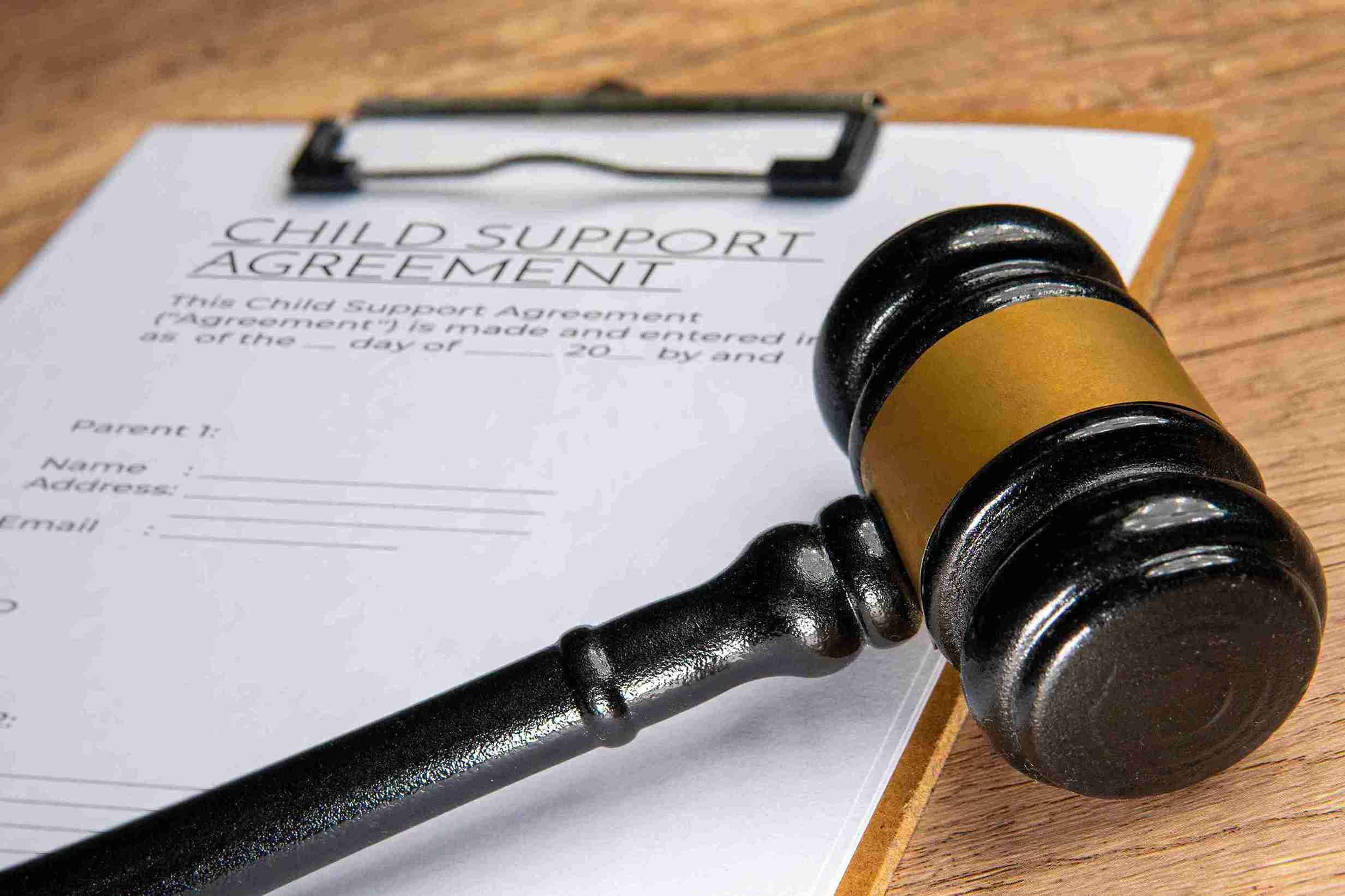 Child support agreement document with signatures, outlining financial responsibilities for child care and support.
