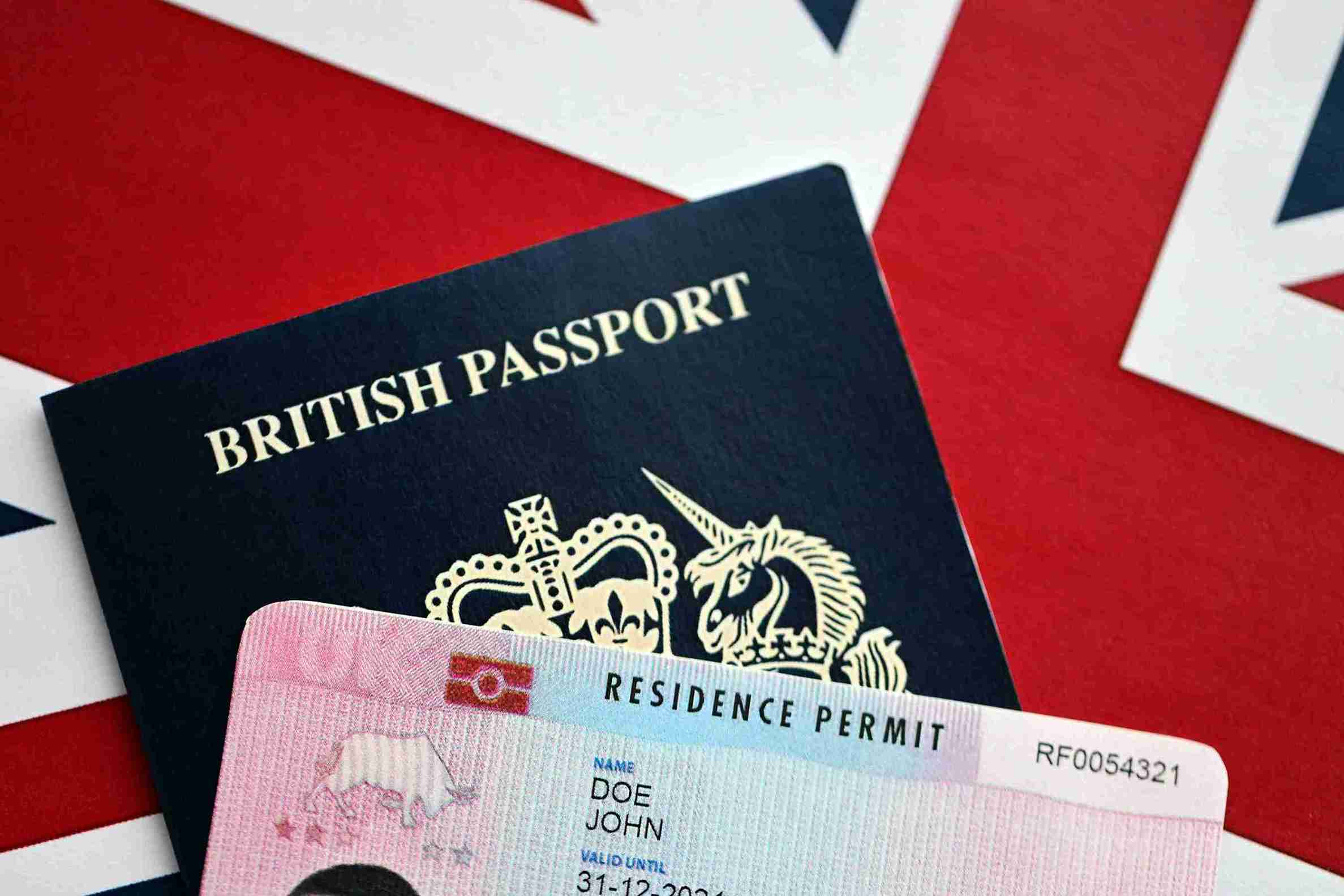 British passport displayed alongside another British passport on a neutral background, highlighting their design and features.
