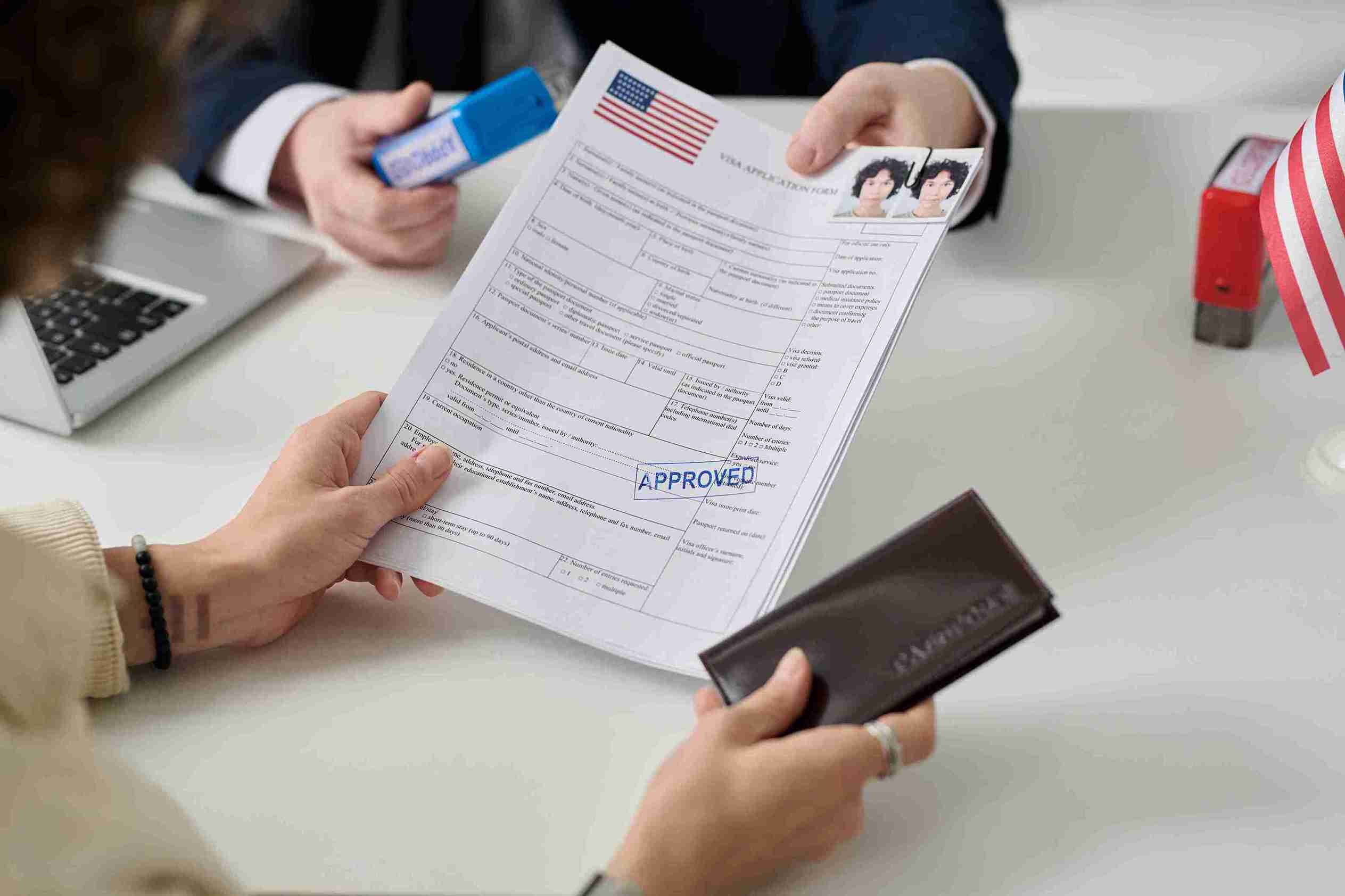 A man and woman hold documents and a passport, appearing ready for travel or an important meeting.
